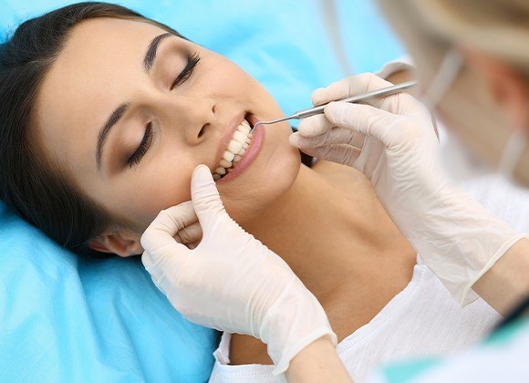woman laying getting gum disease prevention