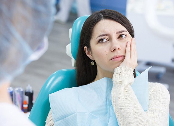 woman with wisdom tooth pain