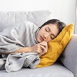 Lady sleeps on couch