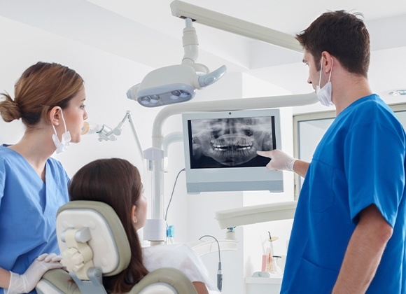 Dentist pointing to x-ray