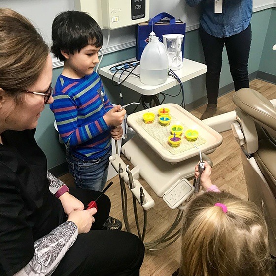 kids playing with dental tools