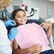 Child smiling at the dentist