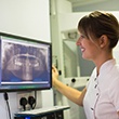 dental implant dentist in Waverly looking at a patient’s X-rays