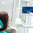 implant dentist in Waverly showing a patient their X-rays