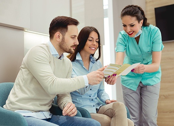 couple looking at insurance paperwork