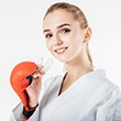 Woman holding mouthguard