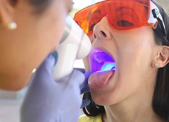 woman getting oral cancer screening