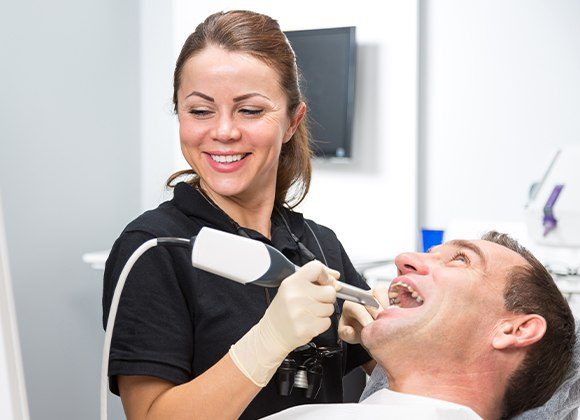 team member using intraoral camera