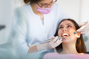 Woman smiling at dentist in Waverly