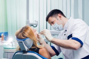 Woman during consultation for full mouth reconstruction in Waverly.