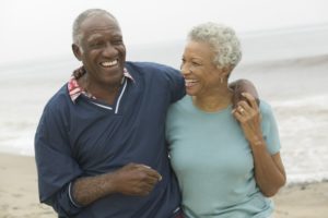 mature couple smiling outdoors 