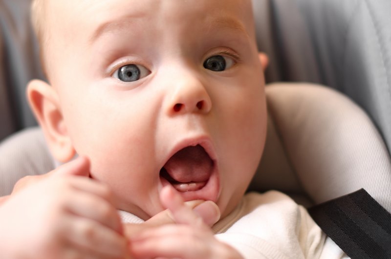 Portrait of a baby sprouting their first teeth